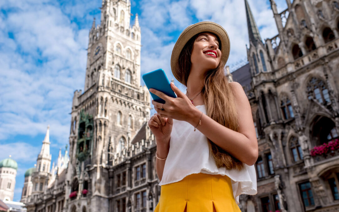 Young female tourist using mobile phone to book online tour while traveling.